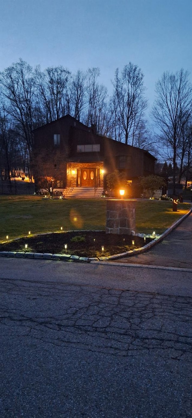 1 Southgate Dr, Cortlandt Manor, NY 10567 - view of home's exterior featuring a lawn and aphalt driveway