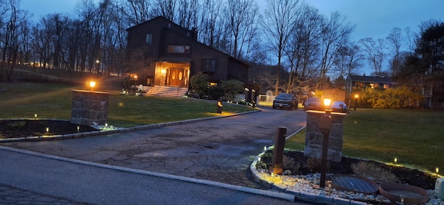 1 Southgate Dr, Cortlandt Manor, NY 10567 - view of front facade featuring a front lawn and driveway