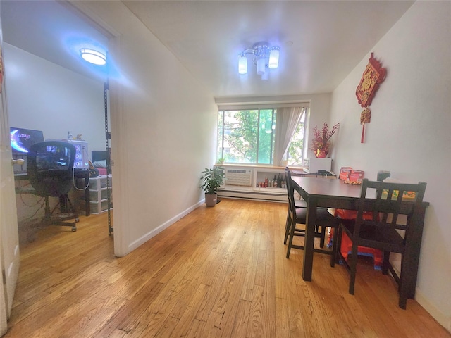 43-17 Union St Unit 2B, Flushing, NY 11355 - dining room with light wood-style flooring and a baseboard heating unit