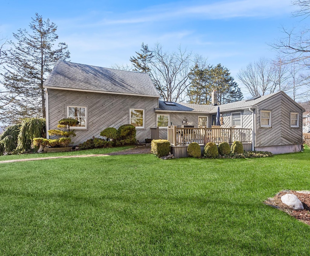 40 Maple Rd, Lake Peekskill, NY 10537 - back of house with a wooden deck, roof with shingles, and a yard