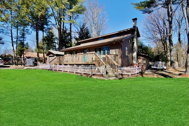 19 W Mitchell St, Smallwood, NY 12778 - back of property featuring a chimney, a deck, and a yard