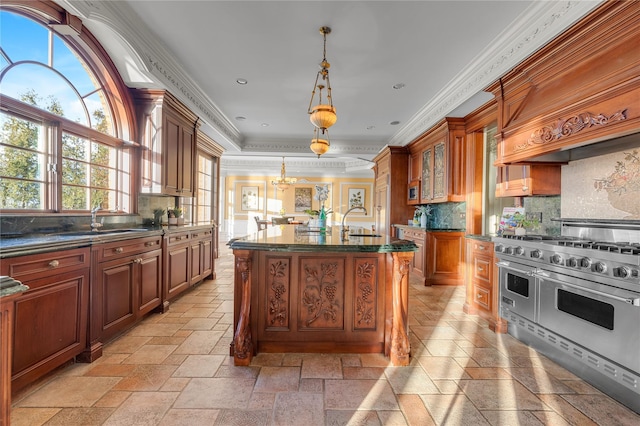 kitchen featuring range with two ovens, ornamental molding, glass insert cabinets, tasteful backsplash, and stone tile floors