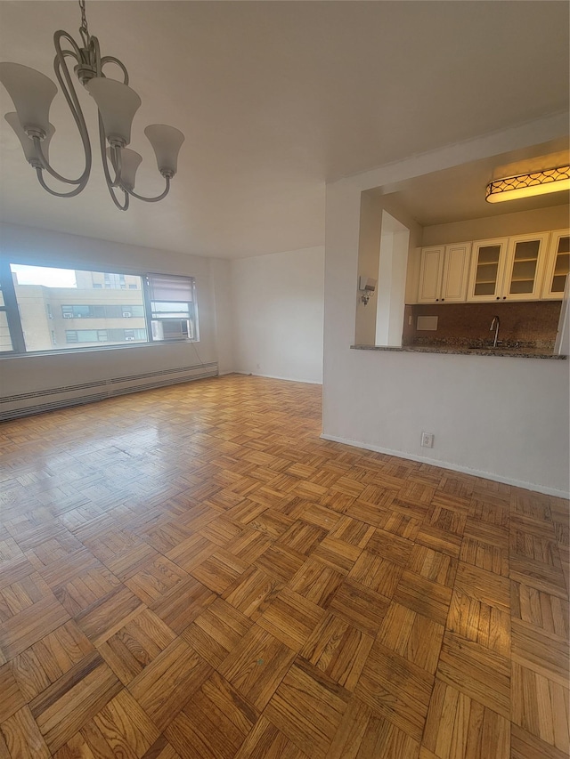 6 Fordham Hill Oval Unit 15F, Bronx, NY 10468 - spare room featuring a chandelier and baseboard heating