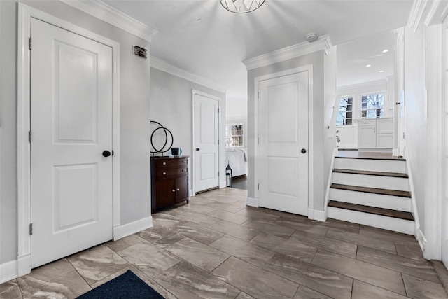 bedroom featuring baseboards, crown molding, and multiple windows