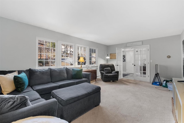 living room with carpet flooring, french doors, and a baseboard radiator