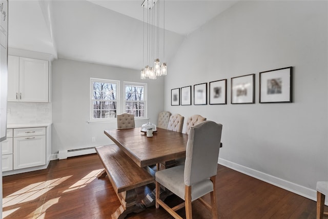 dining room with a baseboard radiator, a notable chandelier, dark wood-style flooring, and lofted ceiling