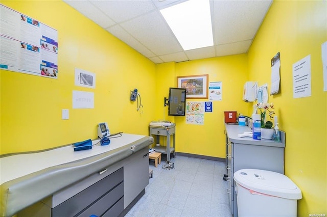 3440 Fulton St, Brooklyn, NY 11208 - misc room with a paneled ceiling, baseboards, and light floors