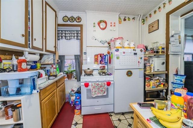 3440 Fulton St, Brooklyn, NY 11208 - kitchen with light floors, white appliances, and light countertops