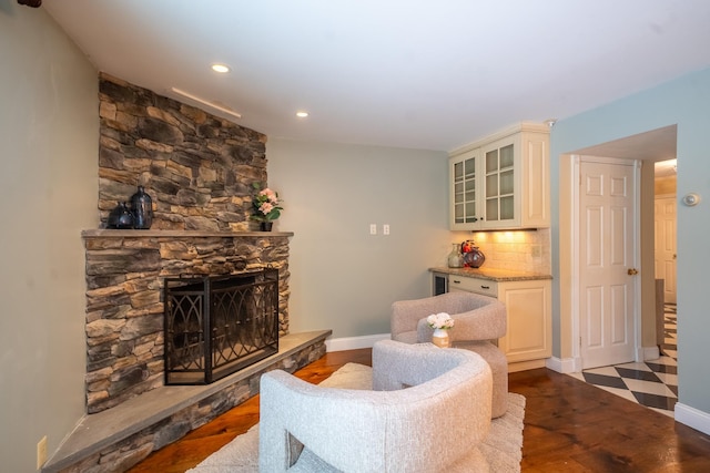 10 Hickory Ln, Glen Cove, NY 11542 - living room featuring baseboards, wood finished floors, recessed lighting, and a stone fireplace