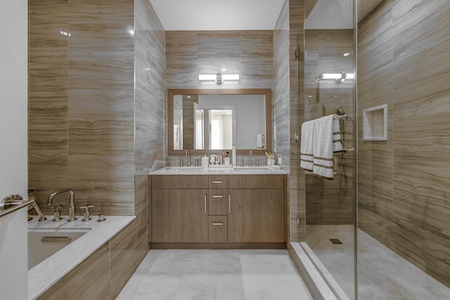 100 Garvies Point Rd Unit 1237, Glen Cove, NY 11542 - bathroom featuring double vanity, a shower stall, and a bath