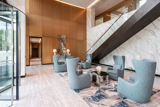 100 Garvies Point Rd Unit 1237, Glen Cove, NY 11542 - building lobby with a towering ceiling and wooden walls