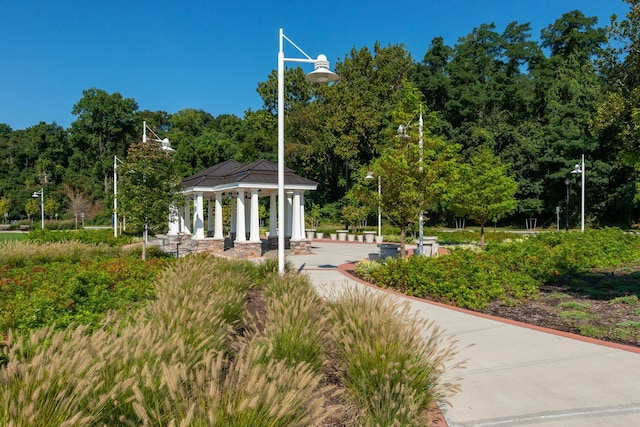 100 Garvies Point Rd Unit 1237, Glen Cove, NY 11542 - view of community with a gazebo and a view of trees