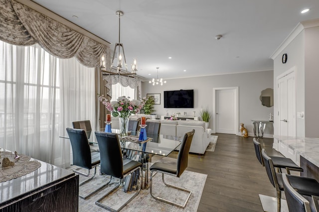 100 Garvies Point Rd Unit 1237, Glen Cove, NY 11542 - dining area with a chandelier, crown molding, dark wood-style flooring, and recessed lighting
