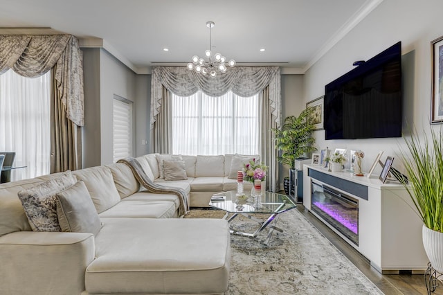 100 Garvies Point Rd Unit 1237, Glen Cove, NY 11542 - living area with ornamental molding, wood finished floors, a chandelier, a glass covered fireplace, and recessed lighting