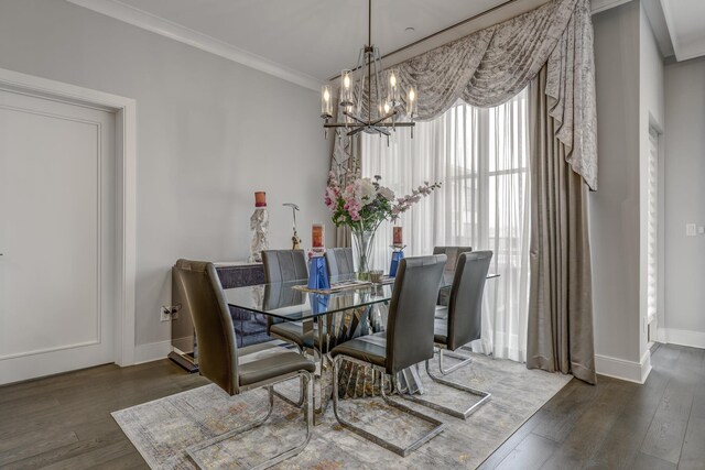 100 Garvies Point Rd Unit 1237, Glen Cove, NY 11542 - dining area featuring a chandelier, crown molding, wood finished floors, and baseboards