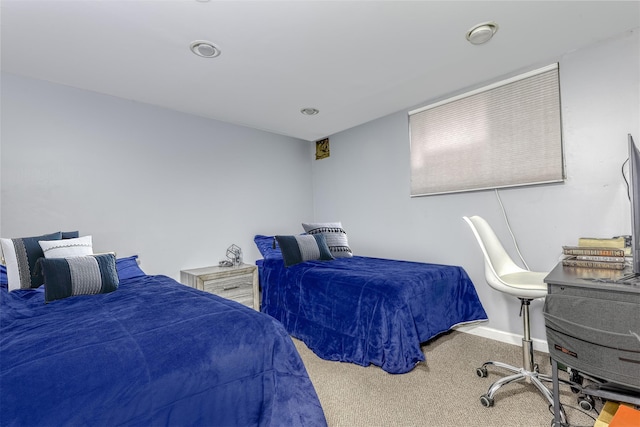 carpeted bedroom with baseboards