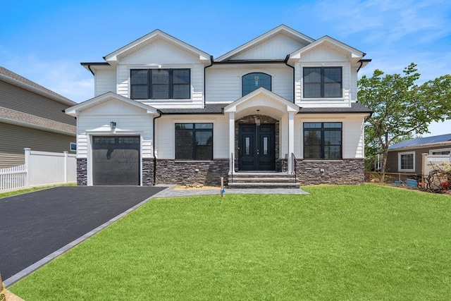 407 Wellington Rd, East Meadow, NY 11554 - view of front facade with stone siding and driveway