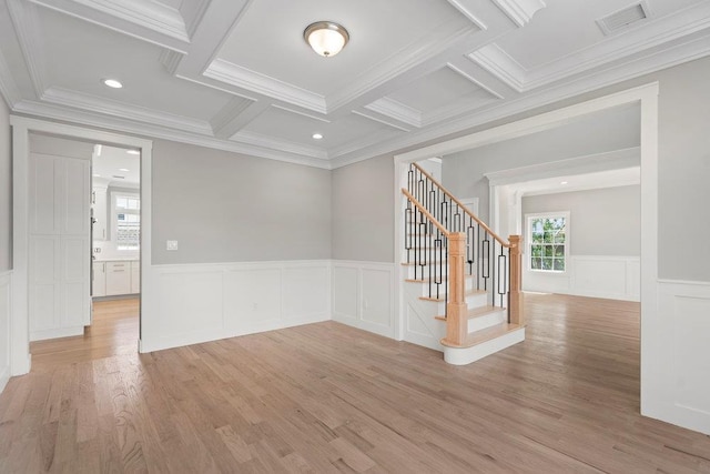 407 Wellington Rd, East Meadow, NY 11554 - unfurnished room featuring crown molding, stairway, coffered ceiling, a wainscoted wall, and light wood-style flooring