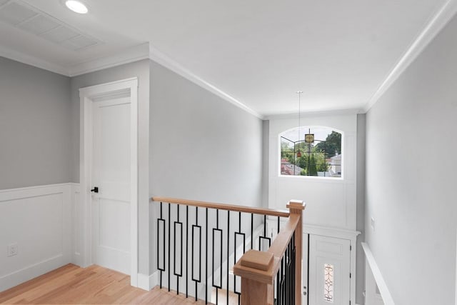 407 Wellington Rd, East Meadow, NY 11554 - hallway featuring an upstairs landing, light wood-style floors, crown molding, and wainscoting