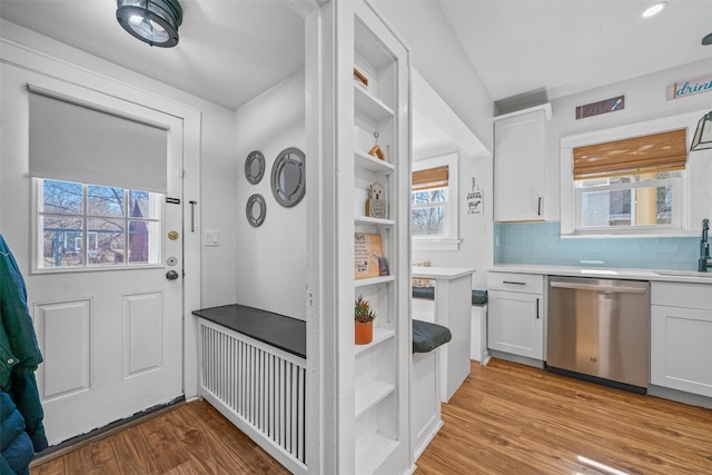 interior space with a sink and light wood-style floors