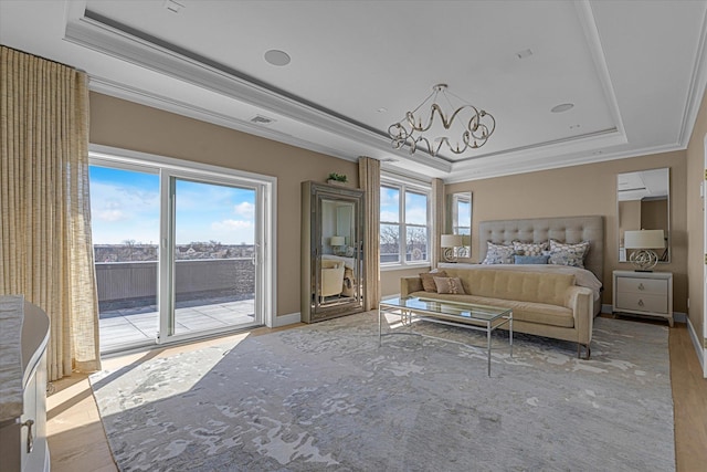 31 Casino St Ph, Ph, Freeport, NY 11520 - unfurnished bedroom with a tray ceiling, access to exterior, ornamental molding, and a chandelier
