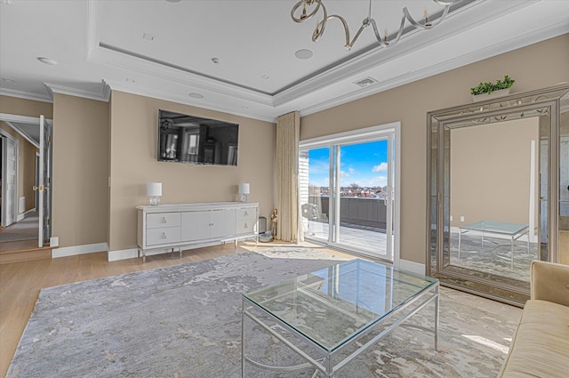 31 Casino St Ph, Ph, Freeport, NY 11520 - unfurnished living room with a tray ceiling, visible vents, wood finished floors, and ornamental molding