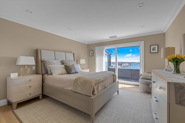 31 Casino St Ph, Ph, Freeport, NY 11520 - bedroom with crown molding, access to outside, baseboards, visible vents, and light wood-style floors