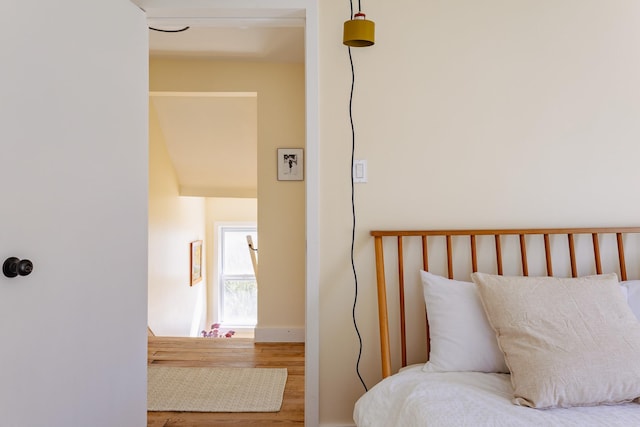 bedroom featuring wood finished floors