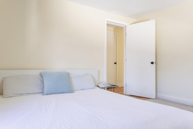 bedroom featuring baseboards
