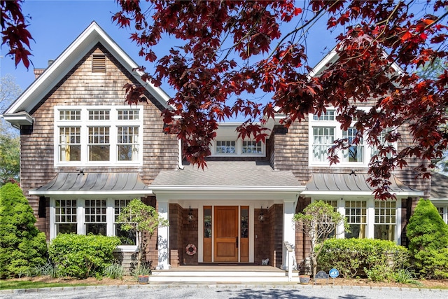 53 Cedar Ln W, Remsenburg, NY 11960 - shingle-style home featuring a standing seam roof, a porch, metal roof, and roof with shingles