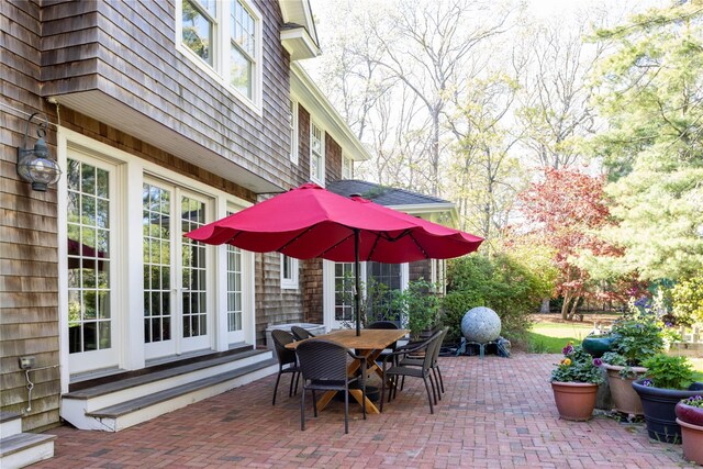53 Cedar Ln W, Remsenburg, NY 11960 - view of patio / terrace with outdoor dining area and french doors