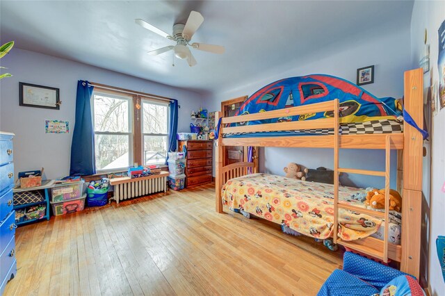 163 Simmons Ave, Call Listing Agent, NY 12047 - bedroom with radiator heating unit, hardwood / wood-style floors, and a ceiling fan