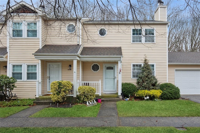 townhome / multi-family property with a chimney, a shingled roof, and a porch