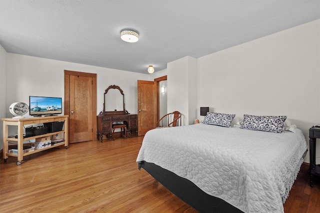 bedroom with light wood finished floors