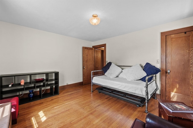 living area with light wood-style floors and baseboards