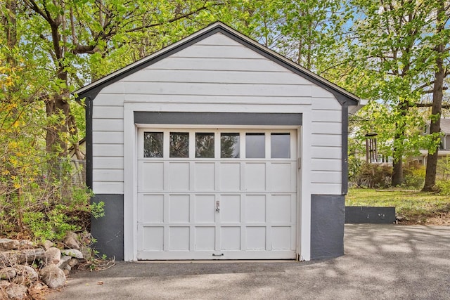 detached garage with aphalt driveway