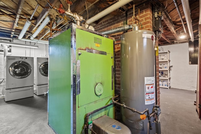utility room featuring water heater and washing machine and dryer