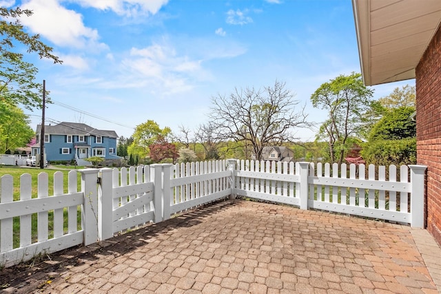 view of patio with fence private yard and a residential view