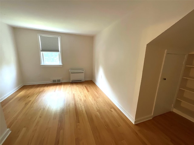 26 Alden Rd, Poughkeepsie, NY 12603 - spare room with light wood-type flooring and heating unit