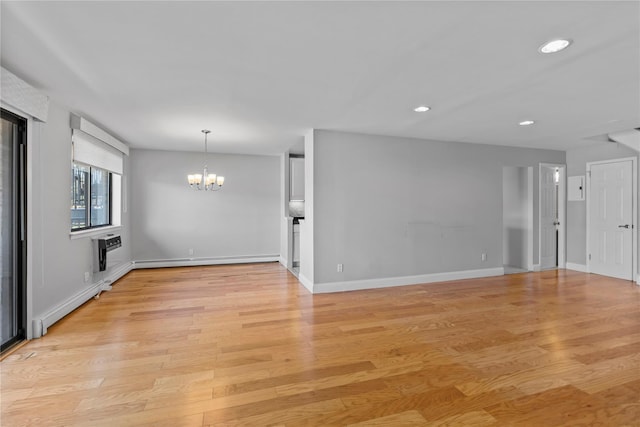 interior space featuring a notable chandelier, baseboard heating, light wood-style floors, recessed lighting, and baseboards