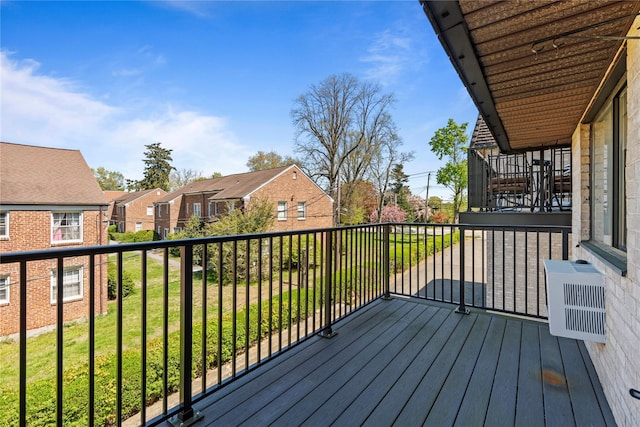 deck with a lawn and a residential view