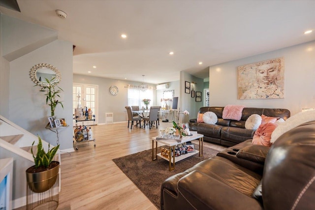 1075 Frances Dr, Valley Stream, NY 11580 - living area with light wood finished floors and recessed lighting