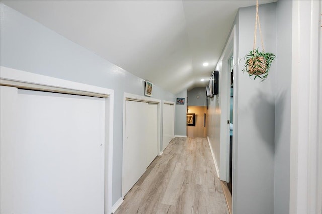 1075 Frances Dr, Valley Stream, NY 11580 - hallway featuring light wood finished floors, vaulted ceiling, and recessed lighting