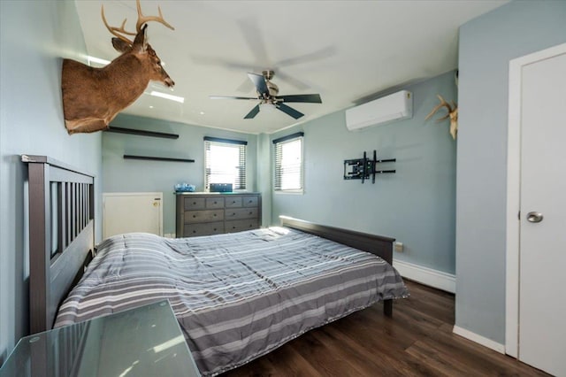 1075 Frances Dr, Valley Stream, NY 11580 - bedroom featuring a wall mounted AC, baseboard heating, wood finished floors, and ceiling fan
