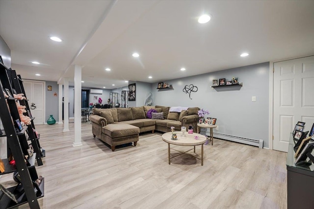 1075 Frances Dr, Valley Stream, NY 11580 - living room featuring a baseboard heating unit, light wood finished floors, and recessed lighting