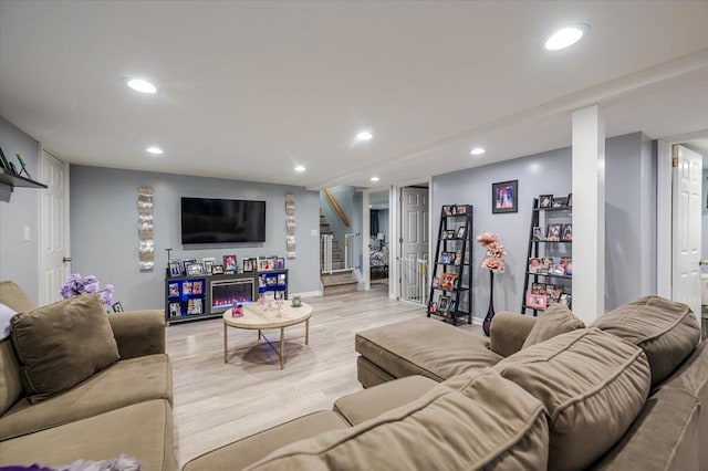 1075 Frances Dr, Valley Stream, NY 11580 - living room with recessed lighting, stairs, and light wood-style flooring
