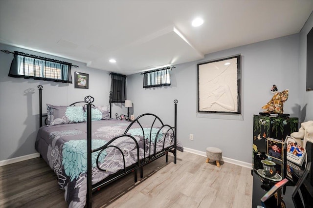 1075 Frances Dr, Valley Stream, NY 11580 - bedroom with multiple windows, light wood-style floors, and recessed lighting