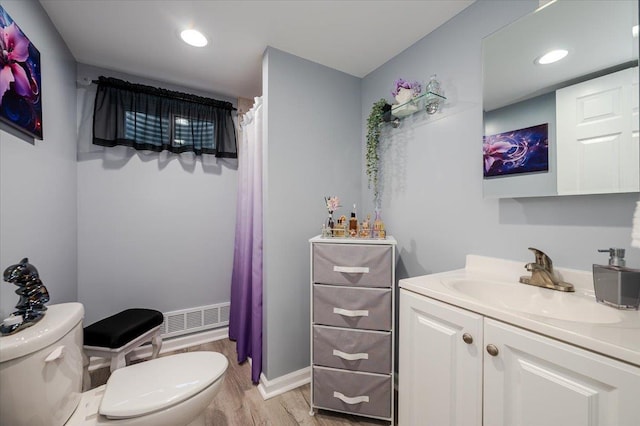 1075 Frances Dr, Valley Stream, NY 11580 - bathroom with wood finished floors, vanity, a shower with curtain, and recessed lighting