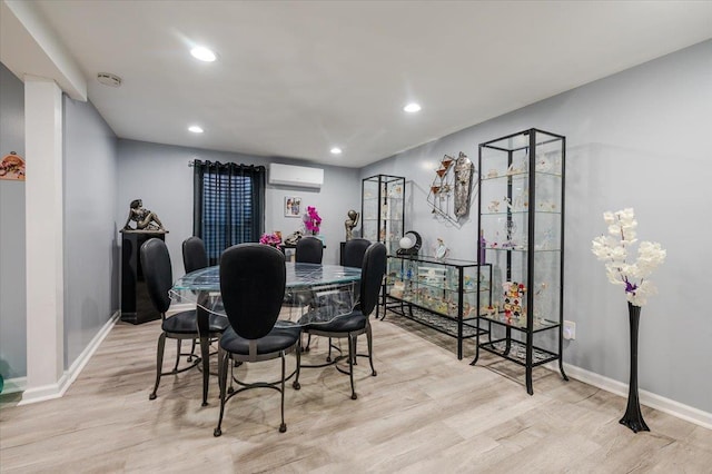 1075 Frances Dr, Valley Stream, NY 11580 - dining area with wood finished floors, a wall mounted air conditioner, and recessed lighting