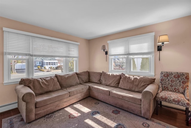 living room with wood finished floors and baseboard heating